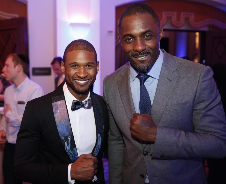 Usher, left, and Idris Elba are seen at the 3rd Annual Sean Penn & Friends HELP HAITI HOME Gala on Saturday, Jan. 11, 2014 at the Montage Hotel in Beverly Hills, Calif. (Photo by Colin Young-Wolff /Invision/AP)