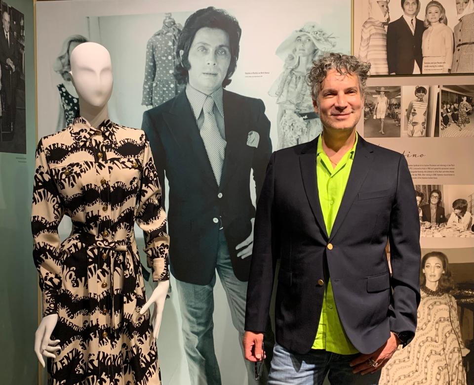 Cameron Silver is known as the "King of Vintage" because of his Decades, his shop on Melrose Avenue in Los Angeles, and his TV appearances. He first came to Palm Beach to seek "treasures in the closets" of well-dressed women in the late 1990s. As guest curator of the "Endless Summer" exhibit, he shares his expertise, posing here with a Valentino dress owned by Martha Phillips and a photo of Valentino himself.