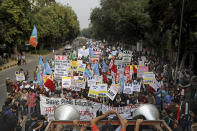 Indian students, activists and members of civil society march towards the Parliament in New Delhi, India, Saturday, Nov. 23, 2019. Hundreds of students of the Jawaharlal Nehru University (JNU) were joined by students from other universities, activists and members of civil society as they marched towards India's parliament to protest against the hostel fee hike, along with their other demands. (AP Photo/Altaf Qadri)