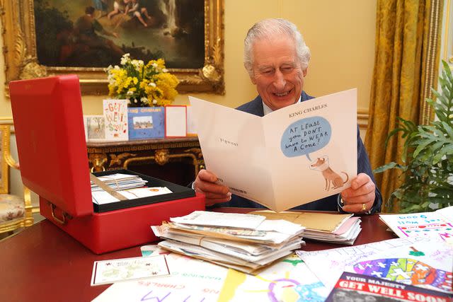 <p>WPA-Rota/Press Association Images</p> King Charles III reads cards and messages, sent by wellwishers following his cancer diagnosis, in the 18th Century Room of the Belgian Suite in Buckingham Palace
