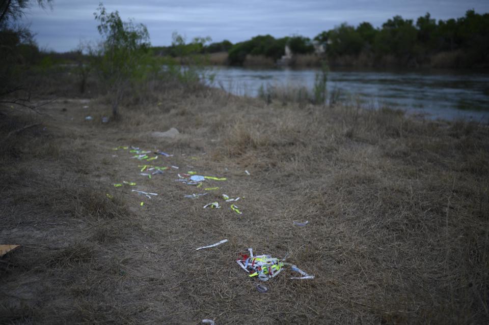 Bracelets used by 'coyote' people smugglers and inscribed with the names of immigrants who crossed illegally from Mexico to the US to seek asylum are discarded near the Rio Grande river.