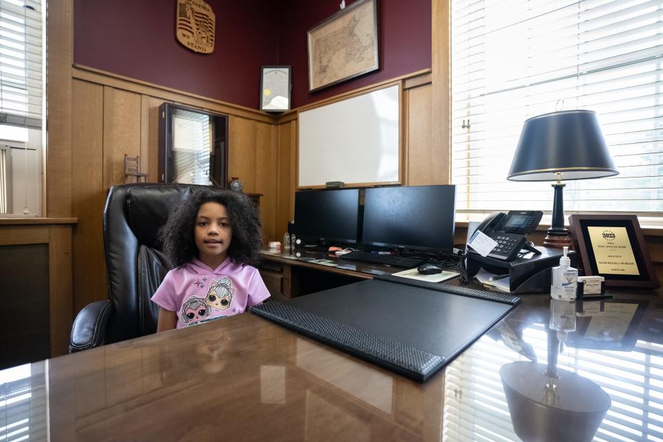 Ciara Barber, 8 of Worcester, sits in the mayor's chair at Gardner City Hall on Thursday.