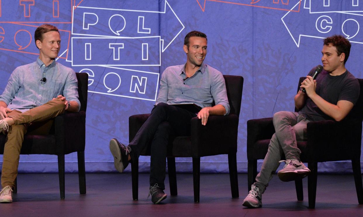 <span>Tommy Vietor (left), Jon Favreau (center) and Jon Lovett (right) at the Pasadena Convention Center in California, on 29 July 2017.</span><span>Photograph: Jim Ruymen/UPI</span>