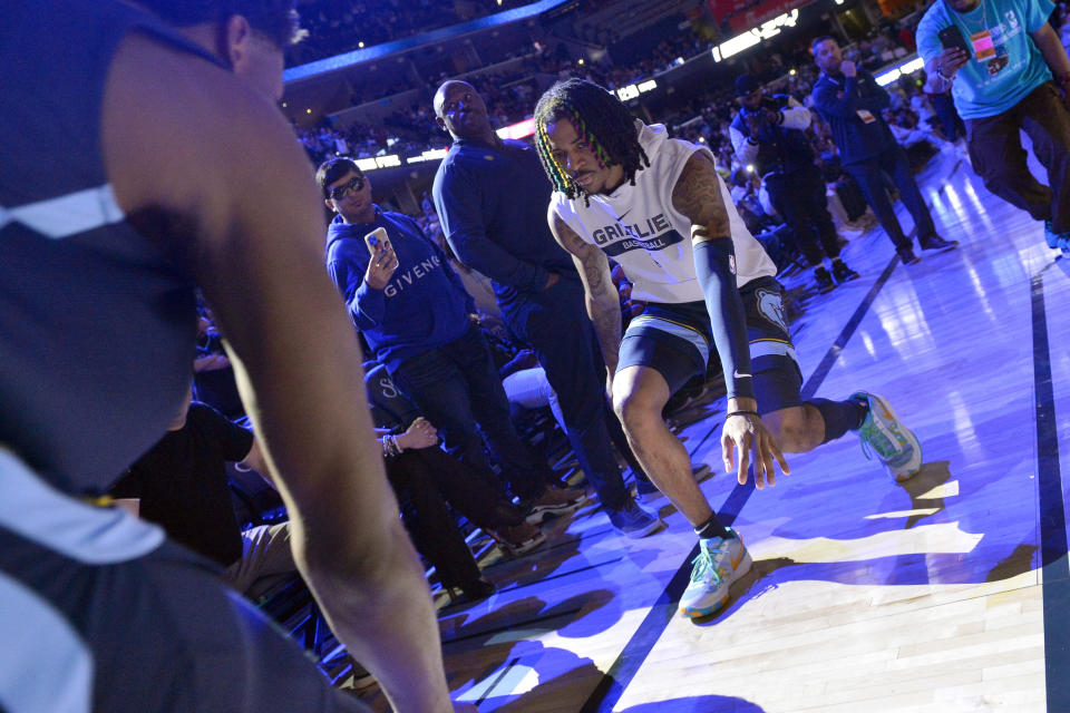 Memphis Grizzlies guard Ja Morant and forward Jaren Jackson Jr., left, warm up before and an NBA basketball game against the Houston Rockets Wednesday, March 22, 2023, in Memphis, Tenn. (AP Photo/Brandon Dill)
