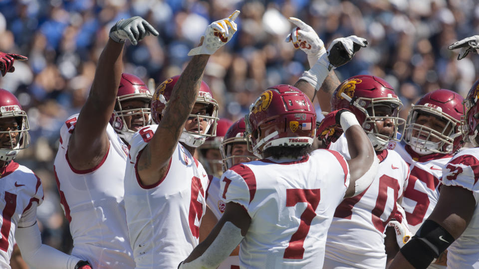 PROVO, UT - SEPTEMBER 14 : Members of the USC Trojans offense celebrate a touchdown against the BYU Cougars at LaVell Edwards Stadium on September 14, in Provo, Utah. (Photo by Chris Gardner/Getty Images)