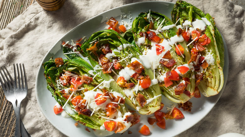 Grilled romaine salad on serving plate