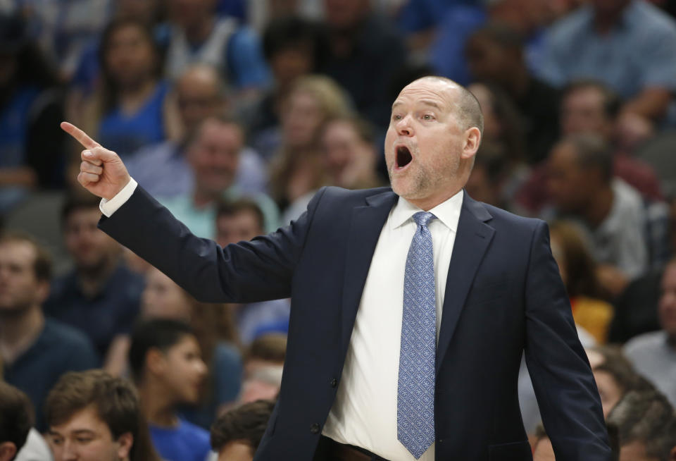 Denver Nuggets coach Michael Malone calls a play as the Nuggets played the Dallas Mavericks during the second half of an NBA basketball game Wednesday, March 11, 2020, in Dallas. The Mavericks won 113-97. (AP Photo/Ron Jenkins)