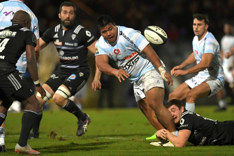 Racing 92' Viliamu Afatia (C) passes the ball during their French Top 14 rugby union match against Brive, at the Yves Du Manoir stadium in Colombes, on February 18, 2017