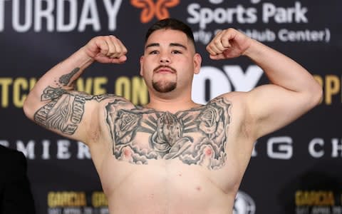 Andy Ruiz Jr. poses on the scale during his official weigh-in ahead of his heavyweight bout against Alexander Dimitrenko at Sheraton Gateway Hotel on April 19, 2019 in Los Angeles, California - Credit: Getty Images