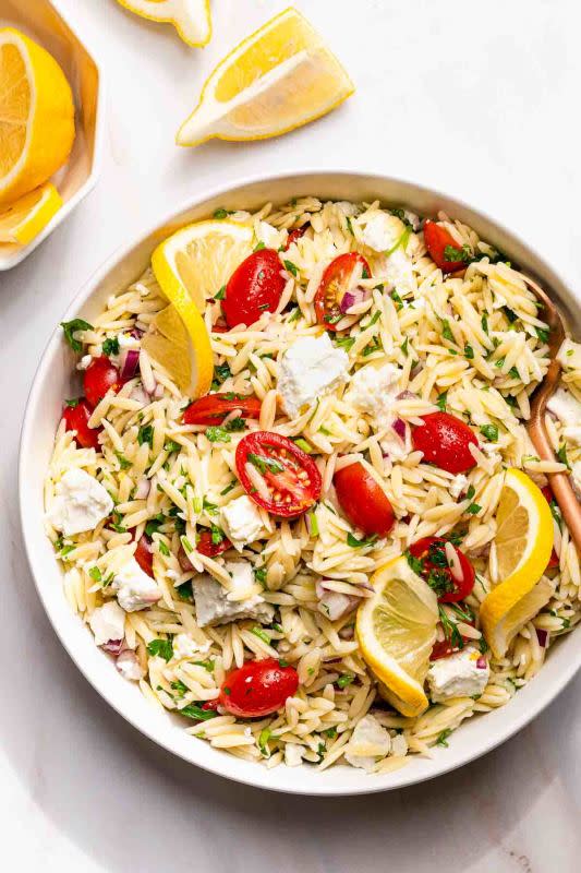 <p>Nibble & Dine</p><p>This lemon orzo salad with feta is tangy and bright, with tons of fresh lemon flavor from both lemon zest and lemon juice. You can make this easy summer side dish with only 8 ingredients and in 25 minutes!</p><p><strong>Get the recipe: </strong><a href="https://nibbleanddine.com/lemon-orzo-salad/?fbclid=IwAR2kjp-6d9OpGFneAGJRFskE799_2uthDu2xB_SYirp0ObH6piIQ2wfAo9M" rel="nofollow noopener" target="_blank" data-ylk="slk:Lemon Orzo Salad;elm:context_link;itc:0;sec:content-canvas" class="link "><strong>Lemon Orzo Salad</strong></a></p>
