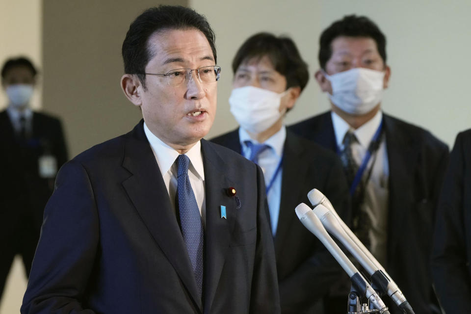 Japanese Prime Minister Fumio Kishida speaks to the reporters at the prime minister's official residence in Tokyo, Tuesday, Feb. 21, 2022. Kishida criticized Russia for violating Ukrainian sovereignty and territorial integrity and said his country will discuss possible “severe actions” including sanctions with the international community. Kishida was responding to Russian President Vladimir Putin’s signing Monday of decree recognizing the independence of two separatist regions in eastern Ukraine, ordering his troops to “maintain peace” in those areas. Putin’s announcement raised fears of an imminent invasion. (Kyodo News via AP)