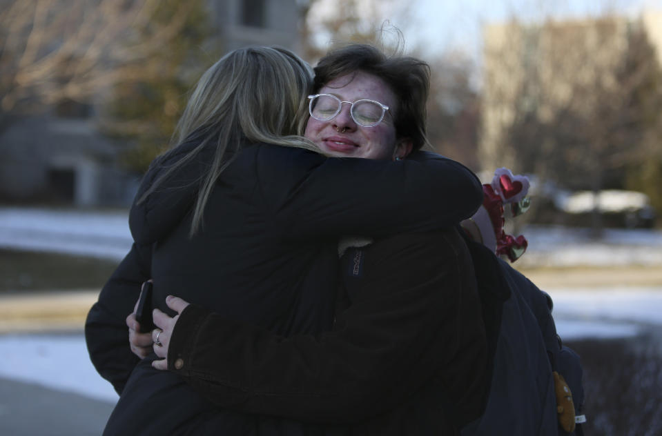 JoEllen Musselman, left, and her son Eli Musselman hug goodbye on the St. Joseph's University campus in Philadelphia on Monday, Feb. 14, 2022. Eli encountered hostility from some in his family's Catholic parish when he came out as transgender almost four years ago but has found support as a freshman at the Jesuit-run university from friends and professors. (AP Photo/Jessie Wardarski)