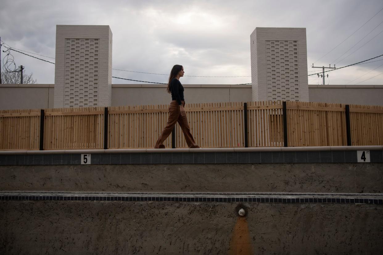 Alexis Soler, entrepreneur and bartender, walks around the poolside that is still under construction at Drift Hotel in Nashville , Tenn., Wednesday, Dec. 20, 2023.