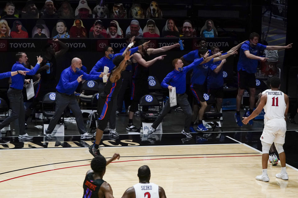 Boise State players and coaches signal that they had possession of the ball during the second half of an NCAA college basketball game against San Diego State, Thursday, Feb. 25, 2021, in San Diego. (AP Photo/Gregory Bull)