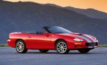 <p>By the turn of the 21st century, the Camaro was both an old product and, seemingly, an irrelevant and archaic one. "Although GM has done a good job of keeping the F-car chassis viable," <a href="http://www.caranddriver.com/comparisons/1999-chevrolet-camaro-z28-vs-ford-mustang-gt-archived-comparison" rel="nofollow noopener" target="_blank" data-ylk="slk:wrote our own Tony Swan;elm:context_link;itc:0;sec:content-canvas" class="link ">wrote our own Tony Swan</a> in 1999, "it's still a live rear axle setup, and it shows us, once again, that live axles have definite handling limits, particularly on bumpy roads. In this case we found that oversteer was just one injudicious stab of the throttle away, and one tester went so far as to call the Z28's handling 'spooky.' " Still, it was quick, running from zero to 60 mph in 5.2 seconds and knocking off the quarter-mile in 13.8 seconds at 104 mph. Chevy celebrated the Camaro's 35th anniversary with a special graphics package on the Z28 SS coupe and convertible—and then killed the car. Seemingly forever.</p>