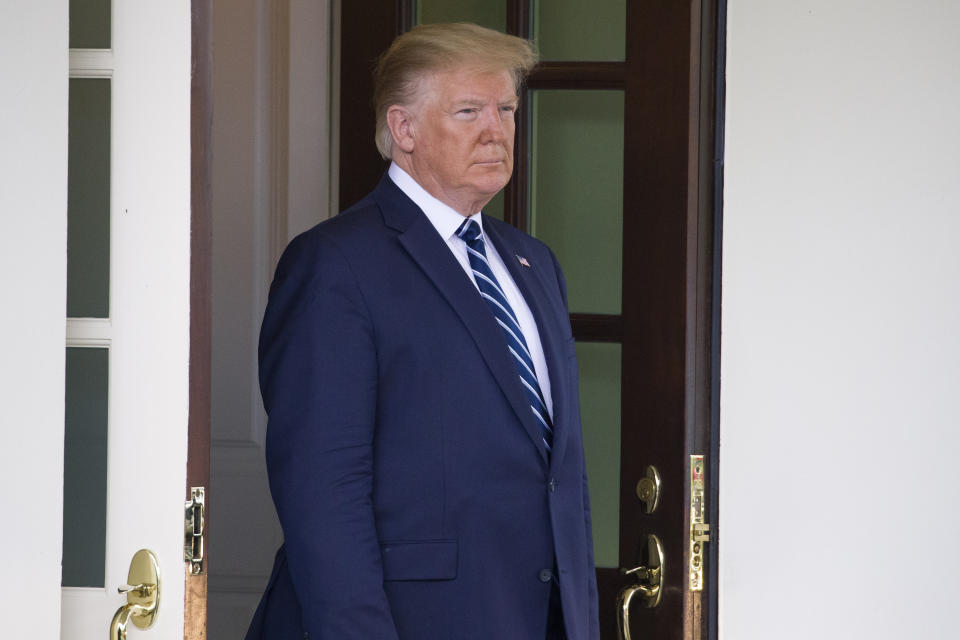 In this June 20, 2019, photo, President Donald Trump awaits the arrival of Canadian Prime Minister Justin Trudeau to the White House in Washington. (AP Photo/Alex Brandon)