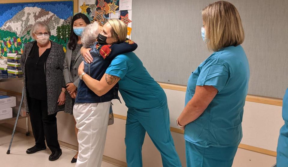 Florence "SeeSee" Rigney says good bye to staff at MultiCare Tacoma General Hospital on her last day.