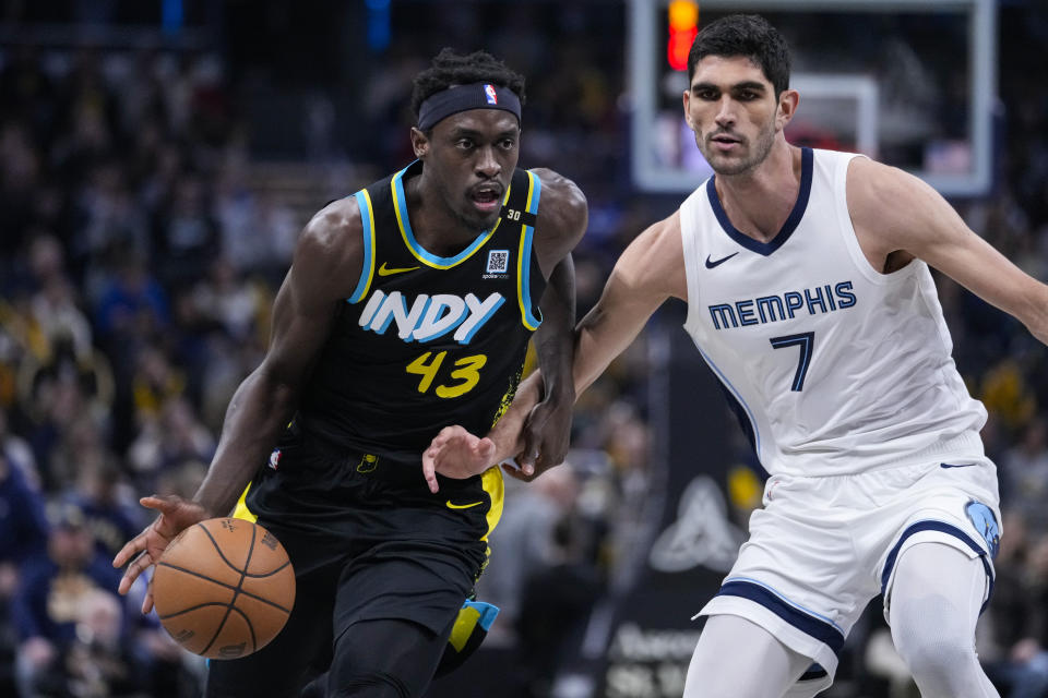 Indiana Pacers forward Pascal Siakam (43) drives on Memphis Grizzlies forward Santi Aldama (7) during the first half of an NBA basketball game in Indianapolis, Sunday, Jan. 28, 2024. (AP Photo/Michael Conroy)