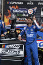 Kyle Larson (5) celebrates after winning a NASCAR Cup Series auto race at Texas Motor Speedway Sunday, Oct. 17, 2021, in Fort Worth, Texas. (AP Photo/Randy Holt)