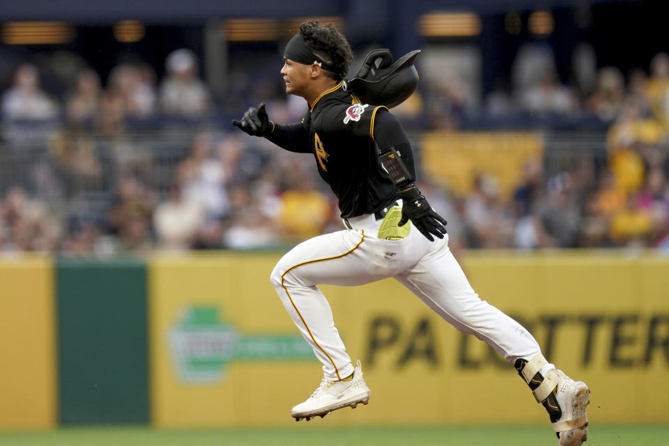 Pittsburgh Pirates' Endy Rodriguez heads to third base for a triple against the Detroit Tigers during the second inning of a baseball game in Pittsburgh, Tuesday, Aug. 1, 2023. (AP Photo/Matt Freed)