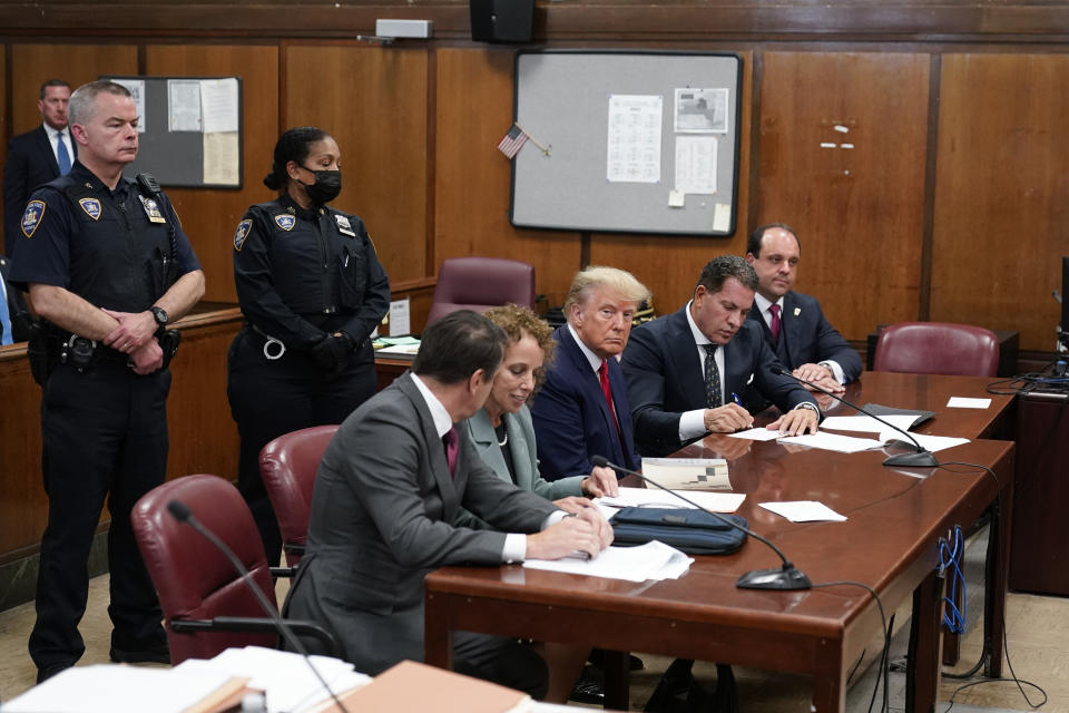 FILE - Former President Donald Trump appears in court for his arraignment on April 4, 2023, in New York. On Monday, April 24, New York prosecutors asked a judge to bar Trump from using evidence from his criminal case to attack witnesses, citing what they say is the former president's history of making “harassing, embarrassing and threatening statements,” about people he's tangled with in legal disputes. (AP Photo/Seth Wenig, Pool, File)