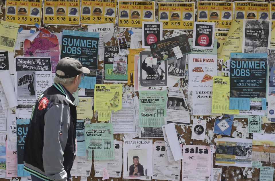 A man walks past a student activities and notices board on the University of California at Berkeley campus in Berkeley, Calif., Thursday, July 18, 2019. Soon students in Berkeley will have to pledge to "collegiate Greek system residences" instead of sororities or fraternities and city workers will have to refer to manholes as "maintenance holes." Berkeley leaders voted unanimously this week to replace about 40 gender-specific words in the city code with gender-neutral terms. (AP Photo/Jeff Chiu)