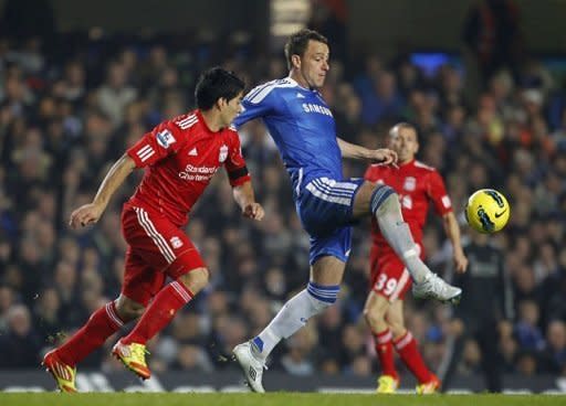 Chelsea's Captain John Terry (R) vies with Liverpool's Luis Suarez during an English Premier League football match at Stamford Bridge in London. Liverpool won 2-1