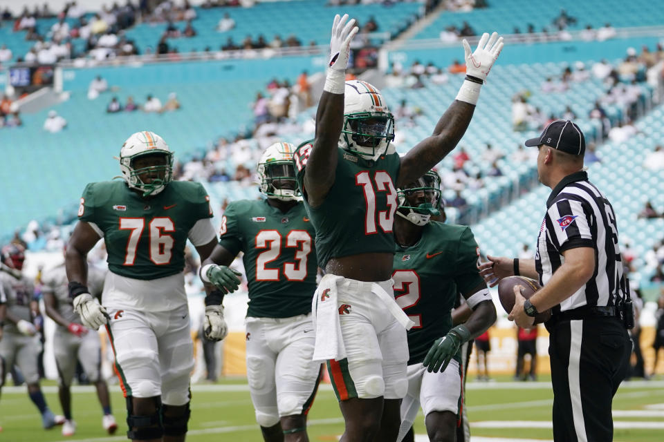 Florida A&M wide receiver Trevonte Davis (13) reacts after scoring a touchdown during the first half of the Orange Blossom Classic NCAA college football game against Jackson State, Sunday, Sept. 3, 2023, in Miami Gardens, Fla. (AP Photo/Lynne Sladky)