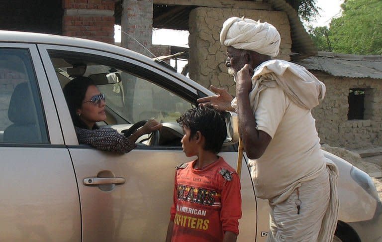 Chhavi Rajawat interacts with villagers in Soda, a remote village in India's Rajasthan state on November 19, 2012. Among the achievements is her arrangement for medical checks of villagers by doctors from the state capital Jaipur