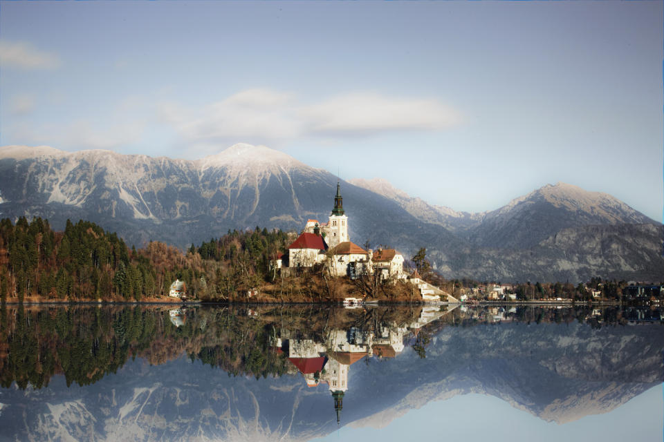 <p>Framed by snowcapped mountains, Lake Bled in Slovenia’s Julian Alps is picture perfect. Warm up with a brisk walk around its majestic water (which takes about an hour), stopping to snap the Church of the Assumptio from different angles. It’s easily accessible from Ljubljana, which you can fly to in just over two hours. <em>[Photo: Getty]</em> </p>