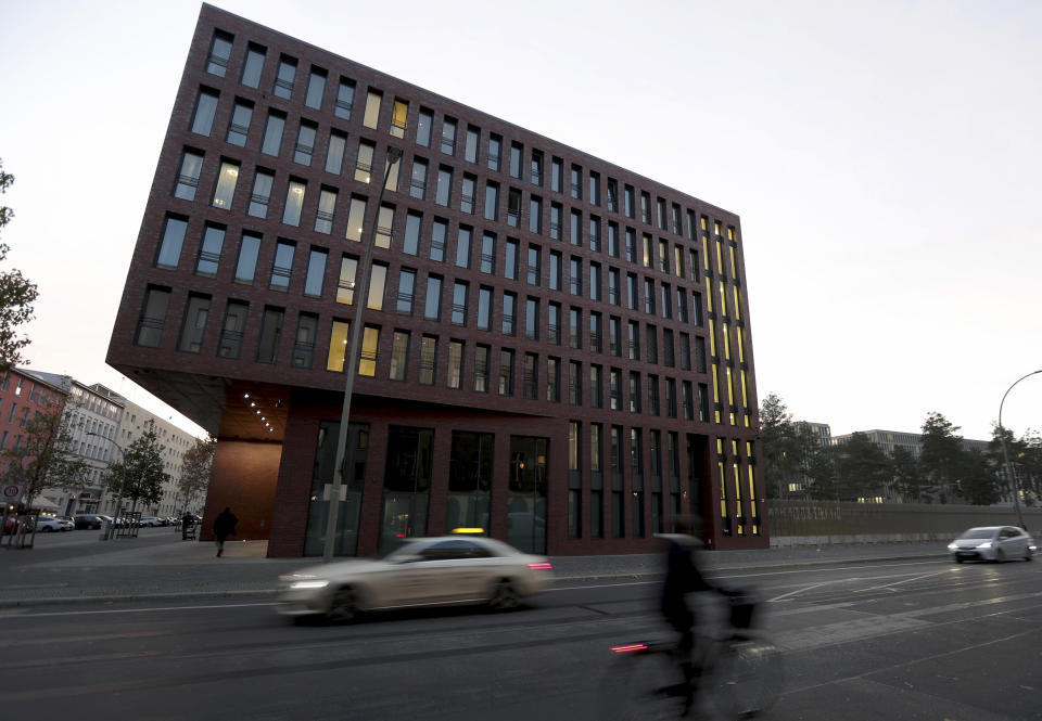 Cars drive past the center for advanced education (ZNAF) at the Federal Intelligence Service (BND) in Berlin, Germany, Tuesday, Nov. 12, 2019. Germany's intelligence agencies are inaugurating a joint spy school in the heart of Berlin, a city that was dubbed the 'capital of spies' during the Cold War and remains a hotspot of espionage.(AP Photo/Michael Sohn)