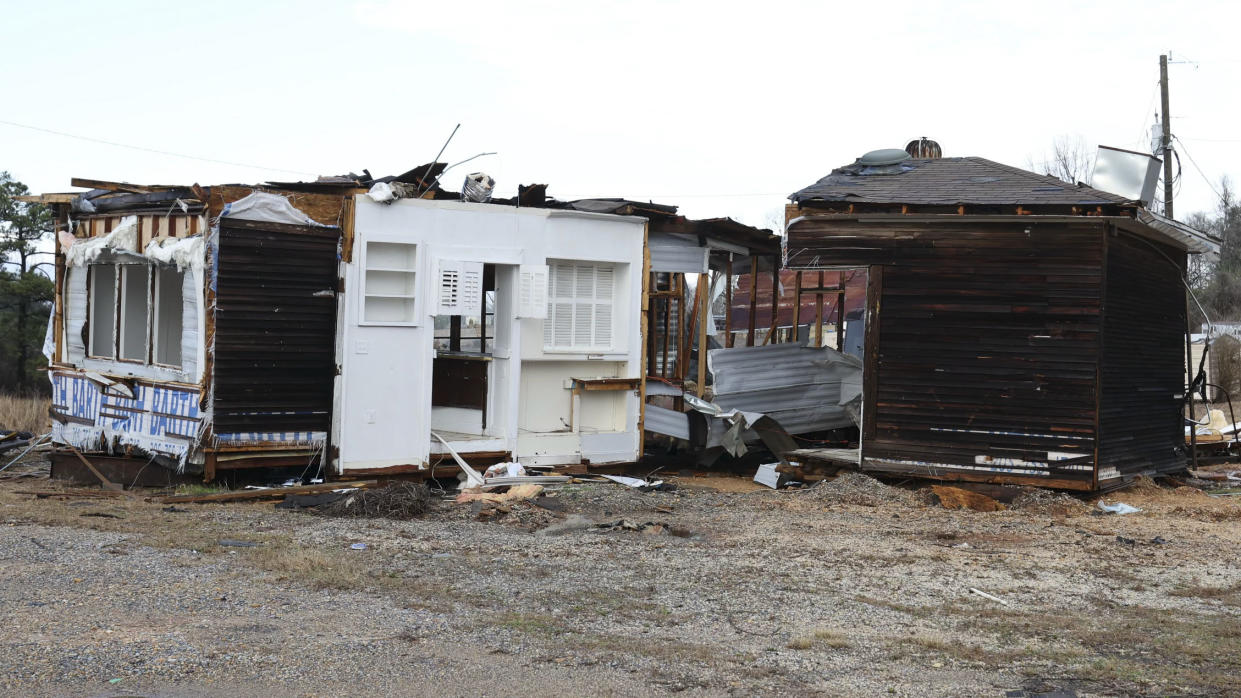 Damaged structures sit on the ground in the aftermath of severe weather, Thursday, Jan. 12, 2023, near Joffre, Ala. A large tornado damaged homes and uprooted trees in Alabama on Thursday as a powerful storm system pushed through the South. (AP Photo/Vasha Hunt)