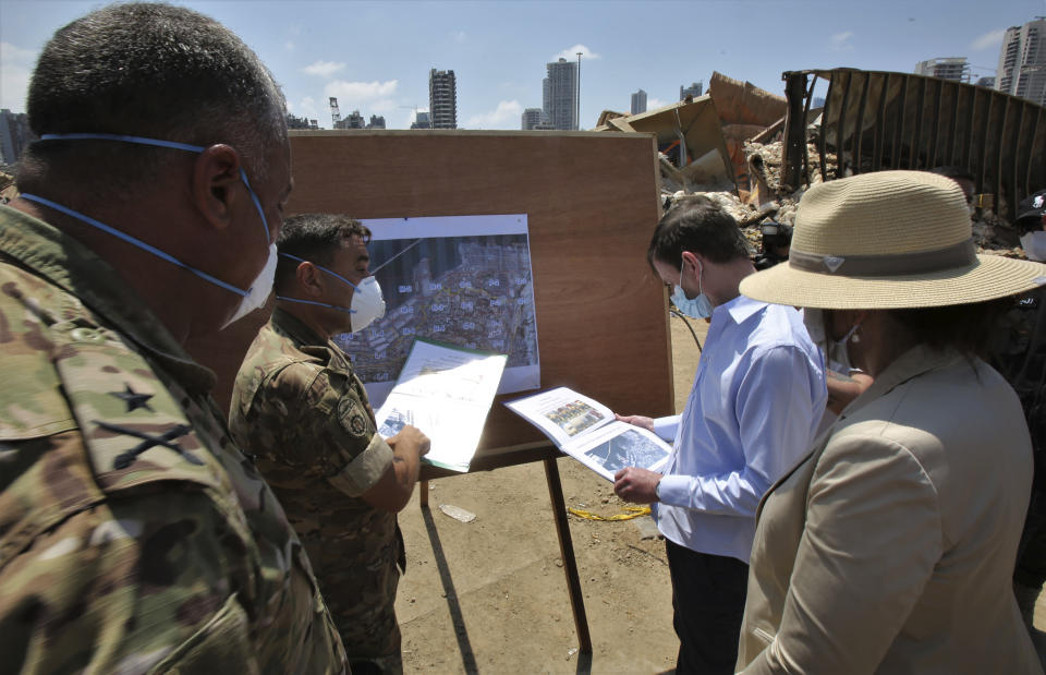 U.S. Undersecretary of State for Political Affairs David Hale, second right, and U.S. Ambassador to Lebanon Dorothy Shea, right, visit the site of the Aug. 4 explosion in Beirut, Lebanon, Saturday, Aug. 15, 2020. (Nabil Monzer/Pool via AP)