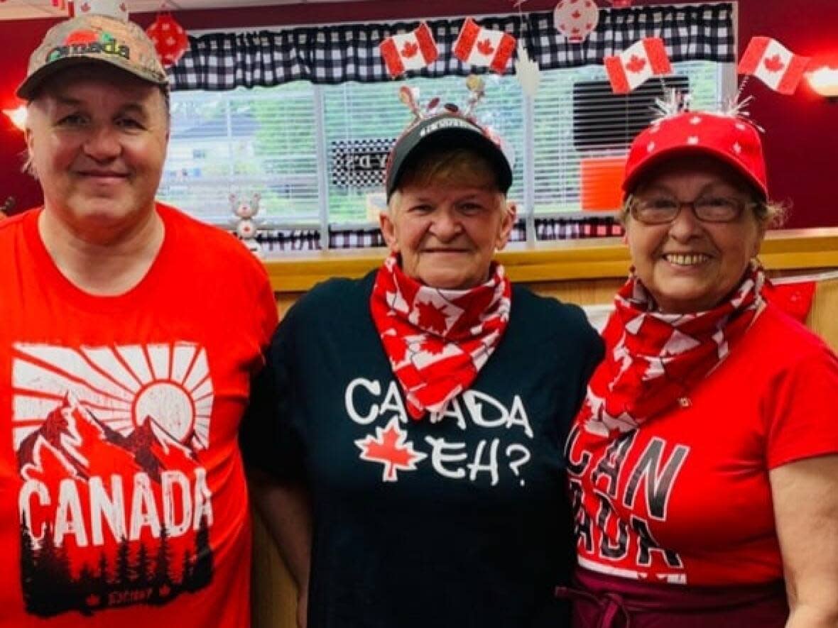 Terry and Joanne Mossop, left and centre, are shown with Mickey D's head waitress Charlene MacEachern. (Submitted by Joanne Mossop - image credit)