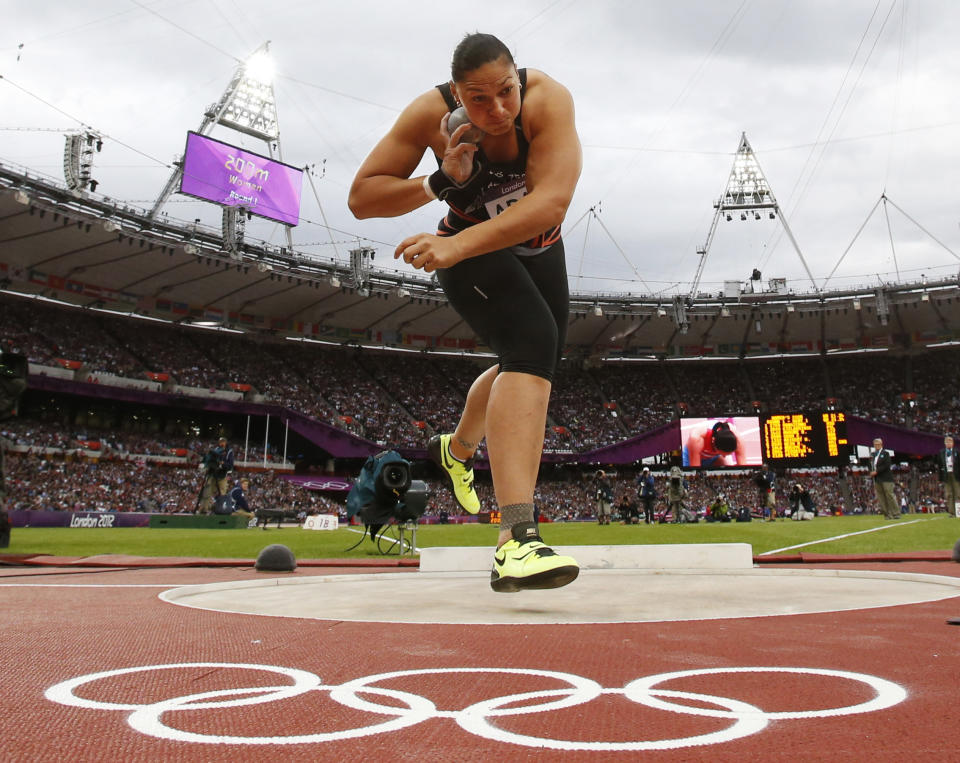 FILE - New Zealand's Valerie Adams takes a throw in the women's shot put final during the athletics in the Olympic Stadium at the 2012 Summer Olympics, London on Aug. 6, 2012. Two-time Olympic women's shot put champion Adams has announced, Tuesday, March 1, 2022, her retirement at the age of 37. (AP Photo/Matt Dunham, File)