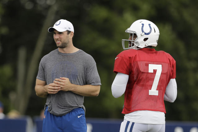 Colts quarterback Andrew Luck talks with media