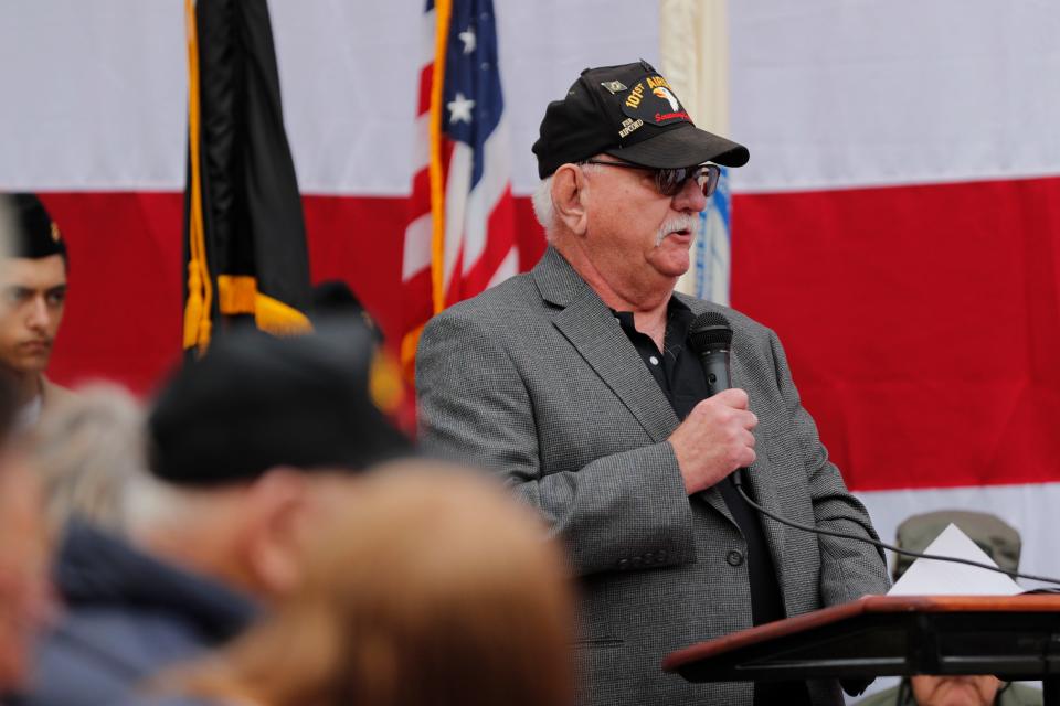 Mike Renner, who served with Robert Kalsu, speaks during a ceremony to unveil a statue of Robert Kalsu at Robert Kalsu Stadium in Del City, Okla., Friday, March 29, 2024.