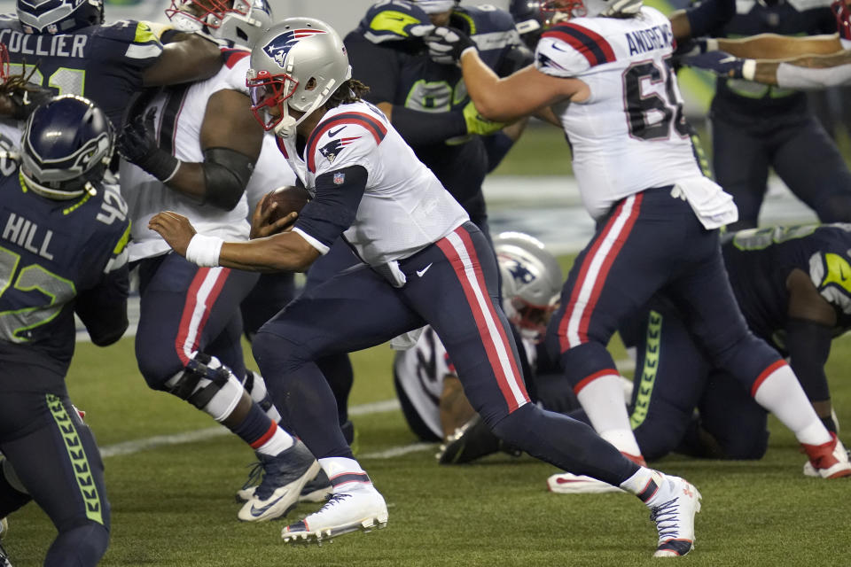 New England Patriots quarterback Cam Newton rushes for a touchdown against the Seattle Seahawks during the second half of an NFL football game, Sunday, Sept. 20, 2020, in Seattle. (AP Photo/Elaine Thompson)