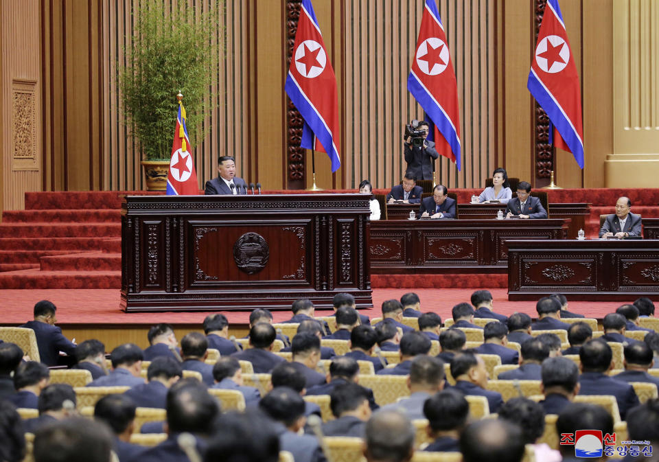 This photo provided by the North Korean government shows North Korean leader Kim Jong Un, left, delivers a speech during a parliament in Pyongyang, North Korea, Sept. 8, 2022. Independent journalists were not given access to cover the event depicted in this image distributed by the North Korean government. The content of this image is as provided and cannot be independently verified. Korean language watermark on image as provided by source reads: "KCNA" which is the abbreviation for Korean Central News Agency. (Korean Central News Agency/Korea News Service via AP)