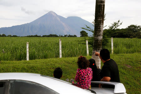 People observe the Fuego volcano from San Miguel Los Lotes in Escuintla, Guatemala June 7, 2018. REUTERS/Luis Echeverria