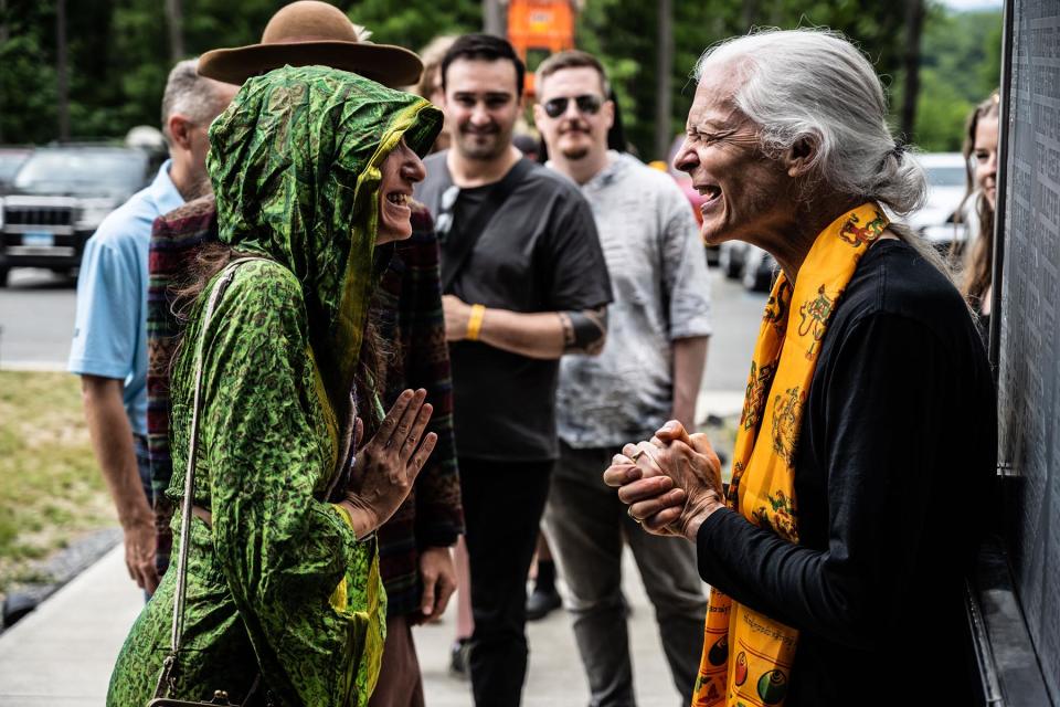 Alex Grey (right) greeting Entheon visitors.