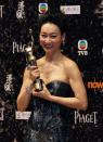 Hong Kong actress Kara Wai poses backstage after winning Best Supporting Actress for her role in the movie "Rigor Mortis" at the 33rd Hong Kong Film Awards in Hong Kong April 13, 2014. REUTERS/Bobby Yip (CHINA - Tags: ENTERTAINMENT)