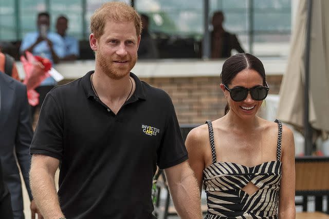 <p>KOLA SULAIMON/AFP via Getty</p> Prince Harry and Meghan Markle visit Nigeria: Unconquered in Abuja, Nigeria on May 11, 2024.