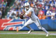 Miami Dolphins quarterback Ryan Fitzpatrick scrambles against the Buffalo Bills in the first half of an NFL football game, Sunday, Oct. 20, 2019, in Orchard Park, N.Y. (AP Photo/Adrian Kraus)