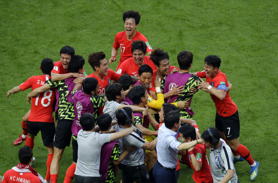 <p>South Korea players celebrate after scoring the opening goal against Germany </p>