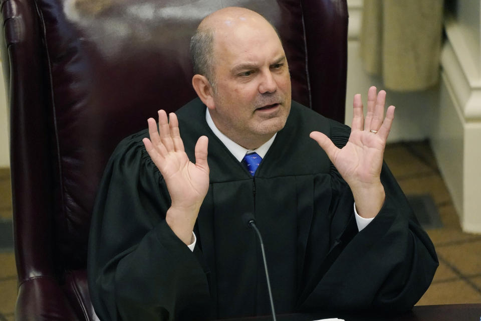 Mississippi Supreme Court Associate Justice Robert Chamberlin, questions attorneys presenting arguments over a lawsuit that challenges the state's initiative process and seeks to overturn a medical marijuana initiative that voters approved in November 2020, Wednesday, April 14, 2021, in Jackson, Miss. (AP Photo/Rogelio V. Solis)