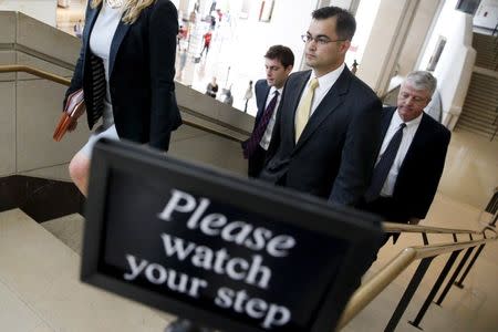 Bryan Pagliano (2nd R), aide to former U.S. Secretary of State Hillary Clinton, departs with his legal team after appearing at a private session of the House Select Committee on Benghazi at the U.S. Capitol in Washington September 10, 2015. REUTERS/Jonathan Ernst - RTSITY