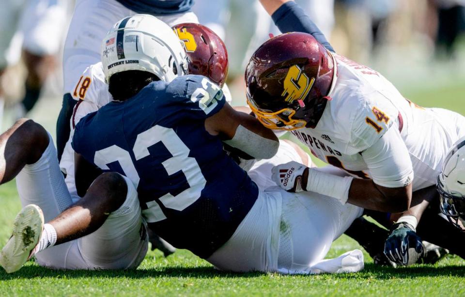 Penn State linebacker Curtis Jacobs grabs the ball that was fumbled on a punt during the game on Saturday, Sept. 24, 2022.