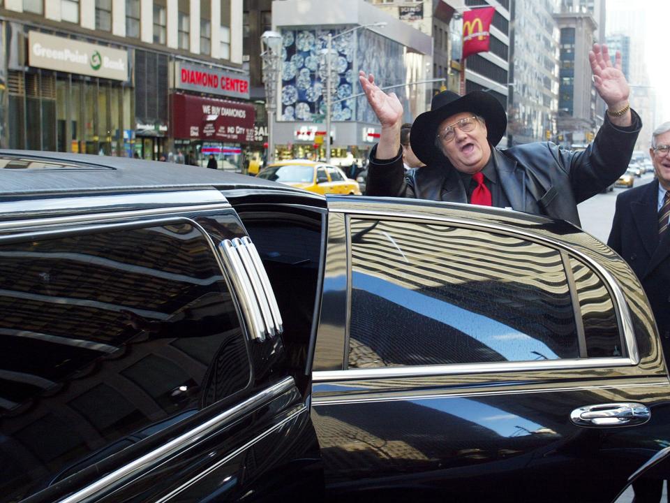 Andrew Jackson aka Jack Whittaker waves as he gets into his rented limousine at Sixth Ave. and 48th St. during a visit to New York City after winning the $314.9 million Powerball jackpot on Christmas day in 2002.