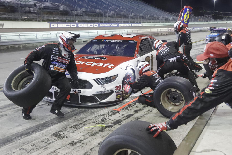 Matt DiBenedetto makes a pit stop during a NASCAR Cup Series auto race Sunday, June 14, 2020, in Homestead, Fla. (AP Photo/Wilfredo Lee)